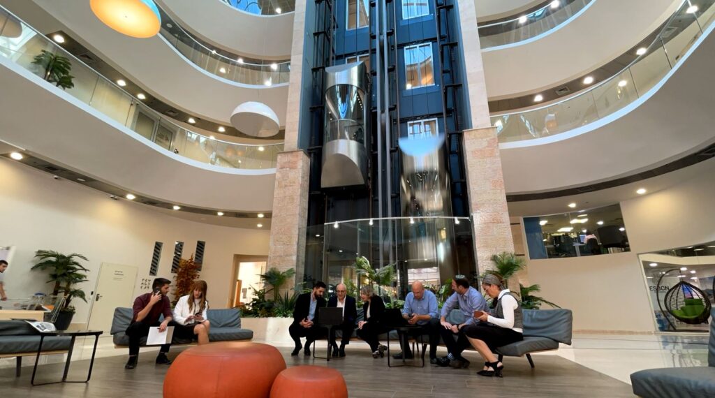 The SMP team in the atrium of the firm's office building